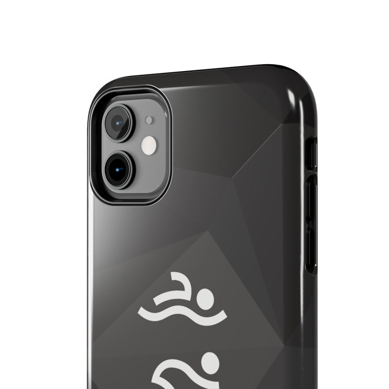 May include: A black smartphone case with a glossy finish and a subtle geometric faceted pattern. The back of the case features two white graphic icons of a person swimming in a freestyle stroke, positioned vertically one above the other.