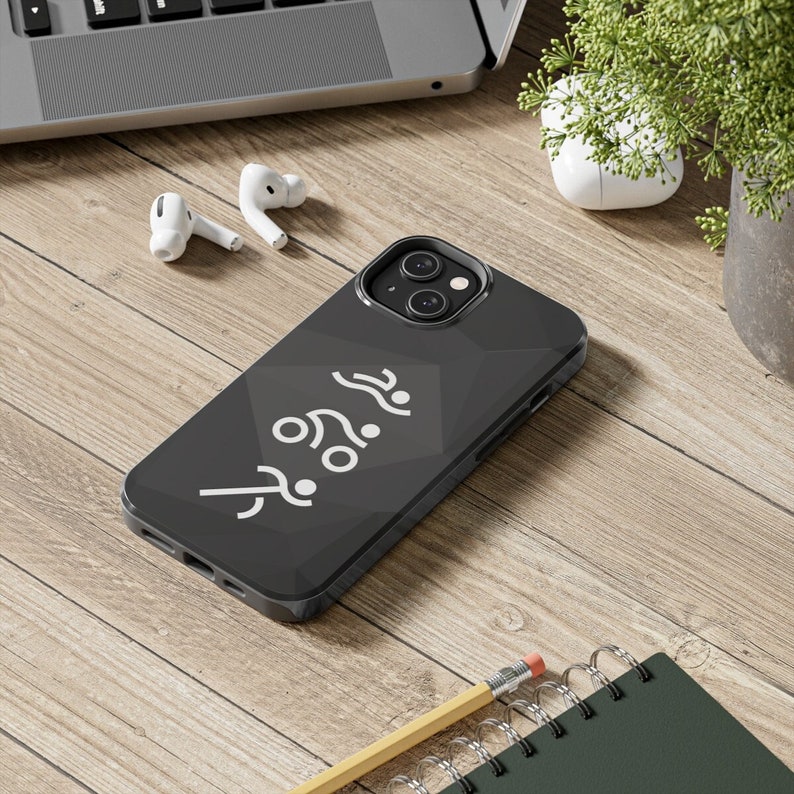 May include: A black smartphone case featuring a geometric pattern and a white graphic print of three stylized figures representing a swimmer, a cyclist, and a runner stacked vertically, indicating a triathlon theme on the back of the device.