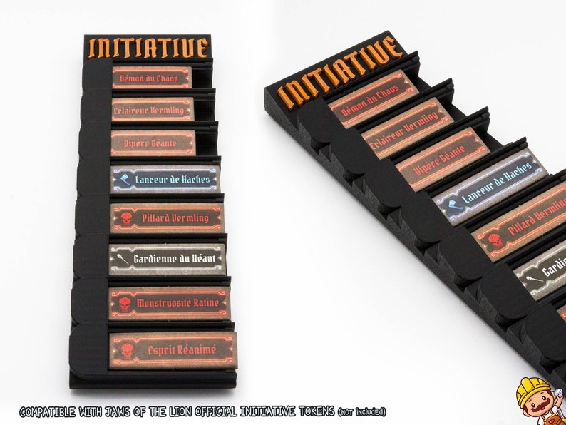 May include: A black plastic initiative tracker stand with orange lettering at the top. It features eight horizontal slots holding rectangular game tokens with French text including Demon du Chaos, Eclaireur Vermling, Vipere Geante, and others.