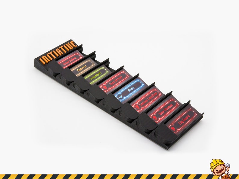 May include: A black plastic initiative tracker stand featuring the word INITIATIVE in orange text. It holds eight rectangular character cards with colored borders and text including Stone Golem, Tinkerer, Scoundrel, Inox Archer, Brute, Savvas Lavasoul, Inox Shaman, and City Guard.