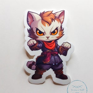 Könnte beinhalten: Ein Cartoon-Aufkleber mit einer weißen und braunen Katze mit orangefarbenen Augen, die eine dunkelblaue Jacke mit einem roten Schal und braunen Stiefeln trägt. Die Katze befindet sich in Kampfstellung mit geballten Fäusten.