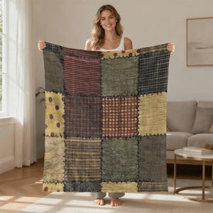 May include: A patchwork quilt featuring a variety of fabrics in shades of brown, red, yellow, and green. The quilt is made of square patches sewn together with visible stitching. The overall design has a rustic, country aesthetic.