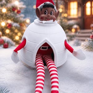 May include: A dark-skinned elf doll with a red hat and white pom-pom, wearing a red and white striped outfit with black shoes, sitting inside a white igloo-shaped structure with a triangular opening and circular side cutouts for the arms.