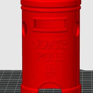 May include: A bright red cylindrical North Pole post box featuring a raised rectangular slot at the top, the embossed text NORTH POLE in the centre, and a snowflake emblem near the base, with a wide arched opening at the bottom of the structure.