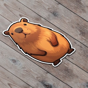 Pode incluir: Uma ilustra&ccedil;&atilde;o de desenho animado de uma capivara marrom com contorno branco. A capivara est&aacute; deitada de costas com as patas para o ar.
