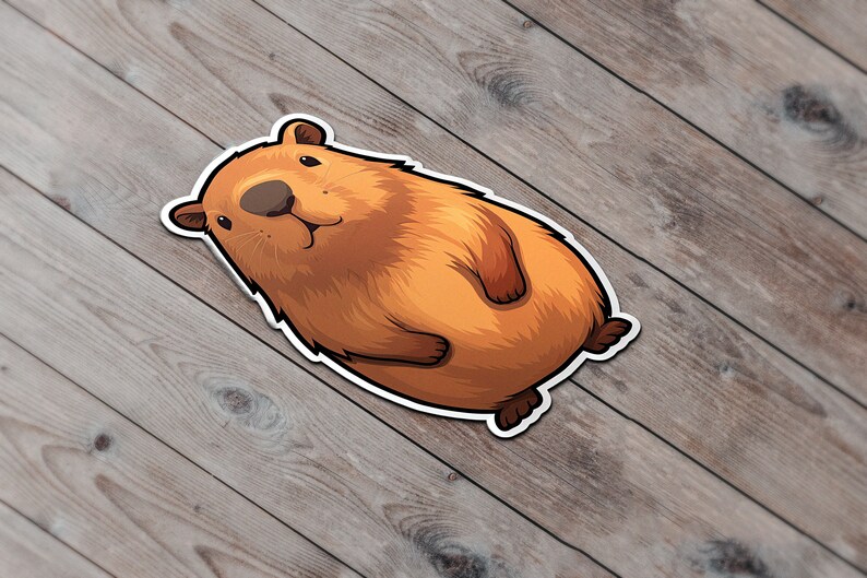 Pode incluir: Uma ilustra&ccedil;&atilde;o de desenho animado de uma capivara marrom com contorno branco. A capivara est&aacute; deitada de costas com as patas para o ar.