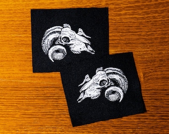 Two goat skulls. Almighty Baphomet. Medieval woodcut. Screen printed patch.