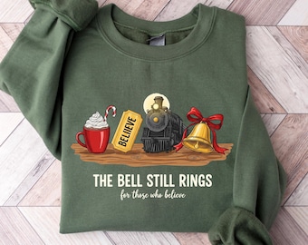 Sudadera «Believe The Polar Express», «La campana aún suena para quienes aún creen», camiseta navideña, sudadera con capucha navideña, camiseta de Navidad