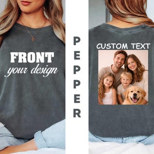 May include: A charcoal gray short-sleeve t-shirt with a vintage wash. The front features the white text FRONT your design. The back displays the white text CUSTOM TEXT above a rectangular color photograph of a family and a golden retriever dog.
