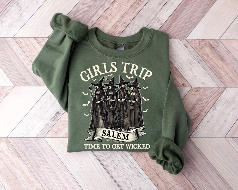 May include: Green sweatshirt with a graphic of four witches and the text "Girls Trip Salem Time to Get Wicked".