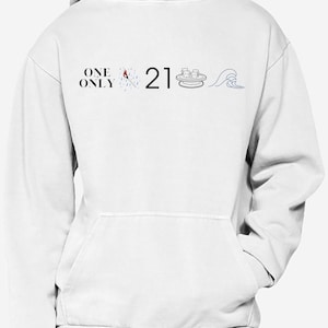May include: White hoodie with the text "ONE ONLY" and the number "21" printed on the front. The text is in black and the number is in a black outline with a red fill. There are also three small graphic images on the front of the hoodie.