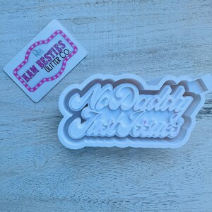 May include: White silicone mold for resin crafts. The mold is shaped like a banner with the text "No Daddy Just Jesus" in a cursive font.
