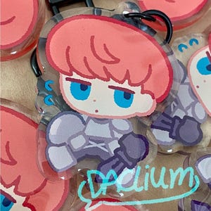 Fear and Hunger D&#39;arce Charm: Double-Sided Epoxy Keychain