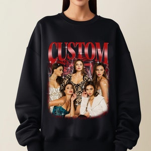 May include: Black sweatshirt with a red "CUSTOM" graphic featuring a group of women in a vintage style.