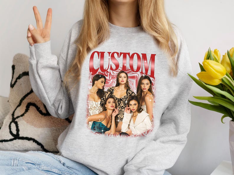 May include: Gray sweatshirt with a red "CUSTOM" graphic featuring five women in a colorful, abstract design.