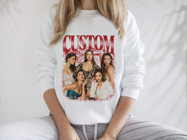 May include: White sweatshirt with a red "CUSTOM" graphic featuring a group of women in a vintage style collage.