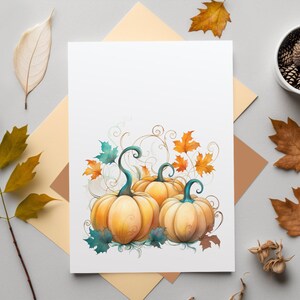 May include: A printable card featuring a watercolor illustration of three pumpkins with green stems and leaves. The pumpkins are surrounded by fall foliage in shades of orange, yellow, and brown.