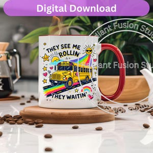 May include: White ceramic mug with a red handle. The mug features a colorful illustration of a school bus with the text "They see me rollin' They waitin'".