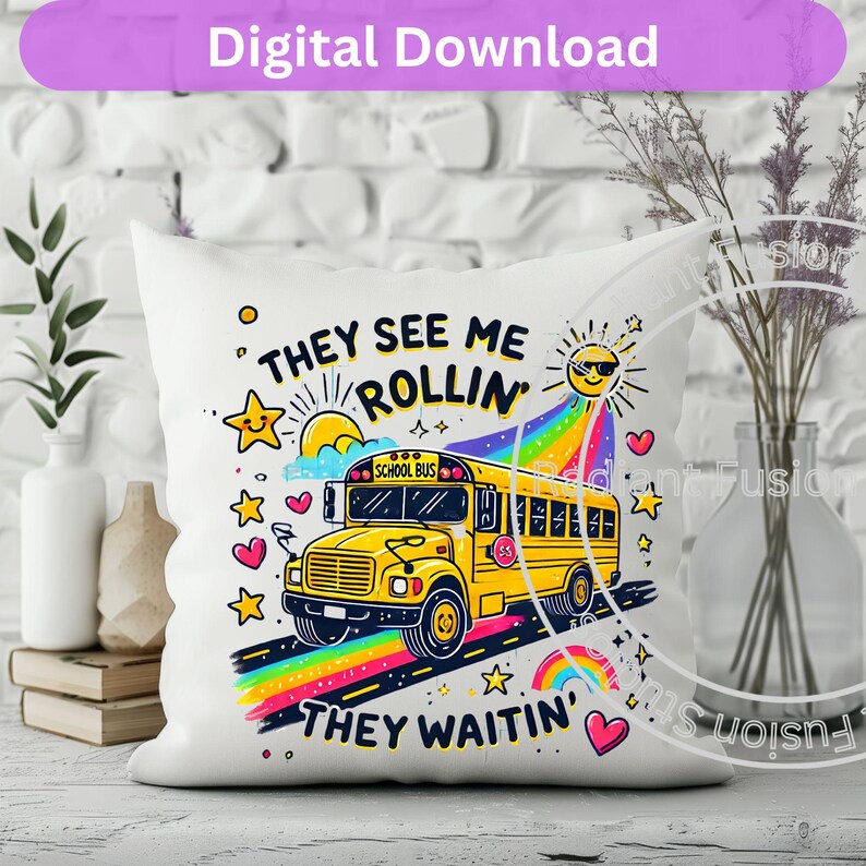 May include: White pillow with a yellow school bus illustration and the text "They see me rollin' They waitin'" in colorful letters. The bus has a rainbow behind it and stars and hearts around it.