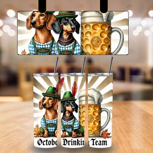 May include: Three stainless steel tumblers with a white background and a design of two dachshunds wearing lederhosen and holding a stein of beer. The tumblers have text that reads "October", "Drinkin'" and "Team".