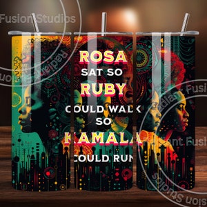 May include: A black and yellow tumbler with a graphic design featuring four women's faces and the text "ROSA SAT SO RUBY COULD WALK SO KAMALA COULD RUN".
