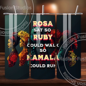 May include: A black tumbler with a colourful design featuring the text "ROSA SAT SO RUBY COULD WALK SO KAMALA COULD RUN".