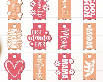 May include: A collection of wooden tags in various shapes and colors, featuring text and designs related to Mother's Day. The tags include phrases like "Happy Mother's Day," "Best Mom Ever," and "Cool Mom," along with floral and heart motifs.