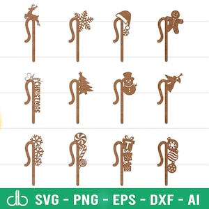 May include: A selection of brown wooden Christmas stakes. Designs include a reindeer, snowflake, Santa hat, gingerbread man, "Merry Christmas" text, a Christmas tree, a snowman, an angel, a candy cane, stacked gifts, and a Christmas ornament.