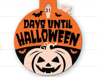 May include: A Halloween-themed wooden ornament with an orange background and black text that reads "DAYS UNTIL HALLOWEEN." The ornament features a carved pumpkin, bats, and a coffin with the number 31. A witch flies above the ornament.
