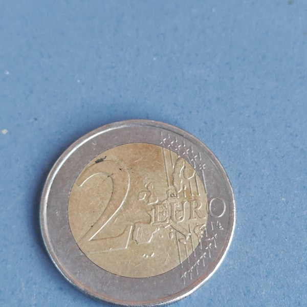 Two euro coin from Greece with error and marked star
