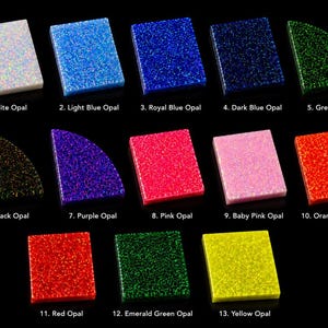 May include: Thirteen rectangular and quarter-circle shaped opal acrylic samples arranged in rows. Colors include white, light blue, royal blue, dark blue, green, black, purple, pink, baby pink, orange, red, emerald green, and yellow with glitter.