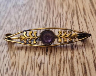 Vintage very old  goldtone brooch with purple amethyst style stone