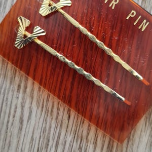 Juego vintage de 2 horquillas para el pelo en tono dorado en forma de V