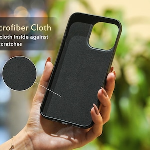 May include: Black phone case with a microfiber lining to protect the phone from scratches. The case has a textured surface and a cutout for the camera lens.