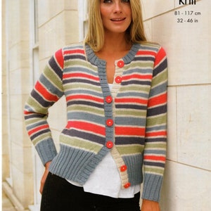 May include: A striped cardigan with a button closure. The cardigan is made of a soft, knit fabric and features a variety of colors, including blue, green, red, and white. The cardigan is shown being worn by a person with long blonde hair. The text "double knit" and "81 - 117 cm 32 - 46 in" is visible in the image.