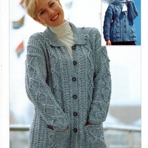May include: A light blue knitted cardigan with a cable knit pattern and a button closure. The cardigan has two pockets and a collar. The text "DENIM Tweed Double Knitting" is visible at the top of the image.