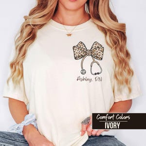 Personalized Nurse T Shirt, Comfort Colors Leopard Bow Stethoscope Tee, Custom Nursing Student Gift,Nurse Graduation Appreciation Sweatshirt