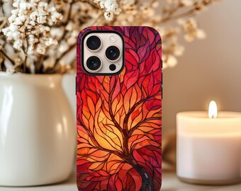 May include: A phone case featuring a vibrant tree design with red, orange, and yellow leaves. The case has a black border and a glossy finish. The design resembles stained glass.