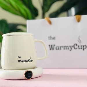 The WarmyCup : Erhöhen Sie Ihr Kaffee- und Tee-Erlebnis mit dem sorgfältig gefertigten Becher- und Wärmer-Pad-Set.