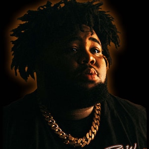 May include: A close-up portrait of a person with dark skin, wearing a gold chain necklace and a black shirt. The person has a beard and short, curly black hair. The background is black with a warm orange glow around the person's head. The text "Rod Wave" is written in white cursive at the bottom right corner of the image.