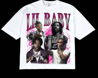 May include: White t-shirt with a pink and white graphic print of Lil Baby. The graphic features four images of Lil Baby in different poses. The text "Lil Baby" is printed in large pink letters at the top of the graphic.