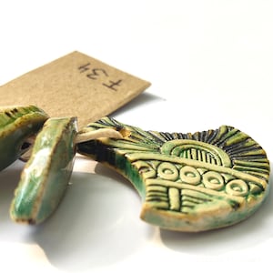 Dijes colgantes de cerámica para hacer joyas.