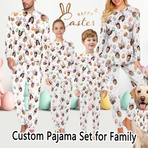 May include: A family wearing matching white pajamas with a custom face print, Easter egg, and bunny ear design. The pajamas are worn by a man, woman, and two children. A dog wears a matching bandana. The words "Happy Easter" are in the background.