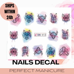 May include: Nail decal sheet featuring geometric animal designs in black outlines over watercolor backgrounds. The sheet includes the text "NAILS DECAL" and "PERFECT MANICURE".