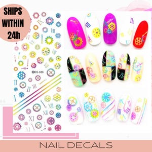 May include: Colorful nail decals featuring a variety of gear and clock designs. The decals are shown on a set of painted fingernails. The text "Ships Within 24h" and "Nail Decals" are also included in the image.