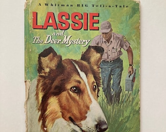 May include: A Whitman Big Tell-a-Tale book cover featuring a collie dog and a man in a ranger uniform. The book title is "Lassie and The Deer Mystery".