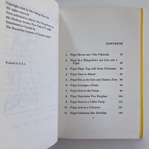 May include: An open book showing the copyright page on the left and the table of contents on the right. The contents list eleven chapters including Pippi Moves into Villa Villekulla, Pippi Goes to School, and Pippi Celebrates Her Birthday.