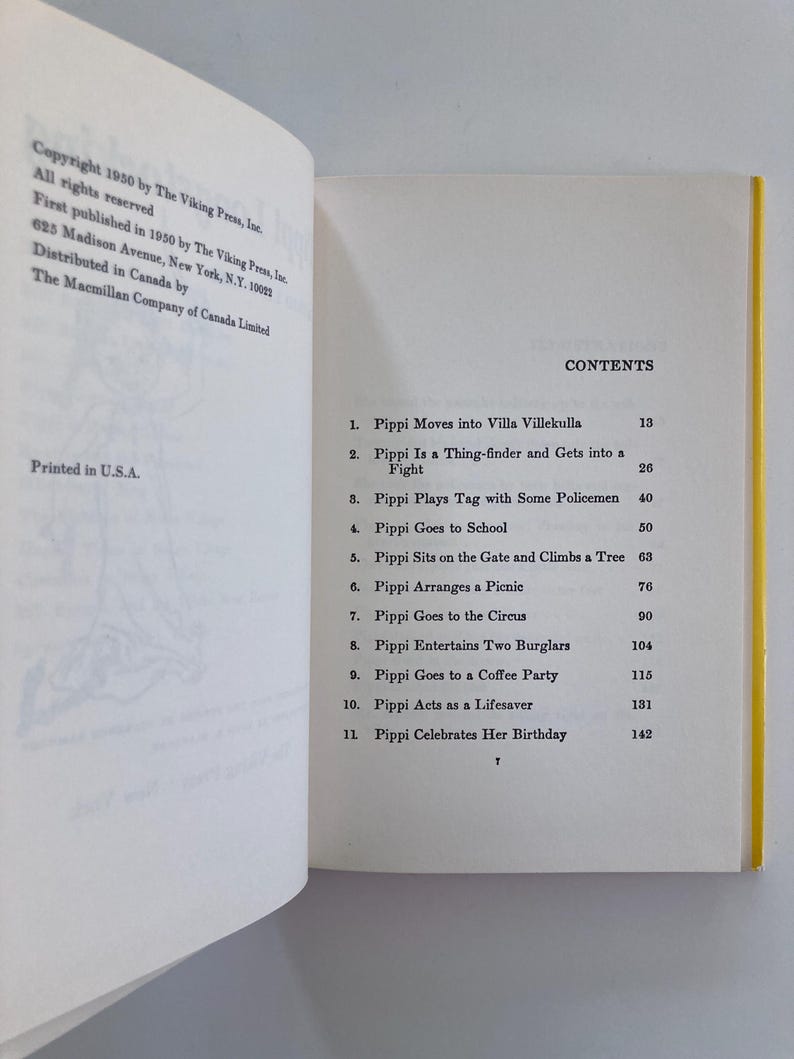 May include: An open book showing the copyright page on the left and the table of contents on the right. The contents list eleven chapters including Pippi Moves into Villa Villekulla, Pippi Goes to School, and Pippi Celebrates Her Birthday.