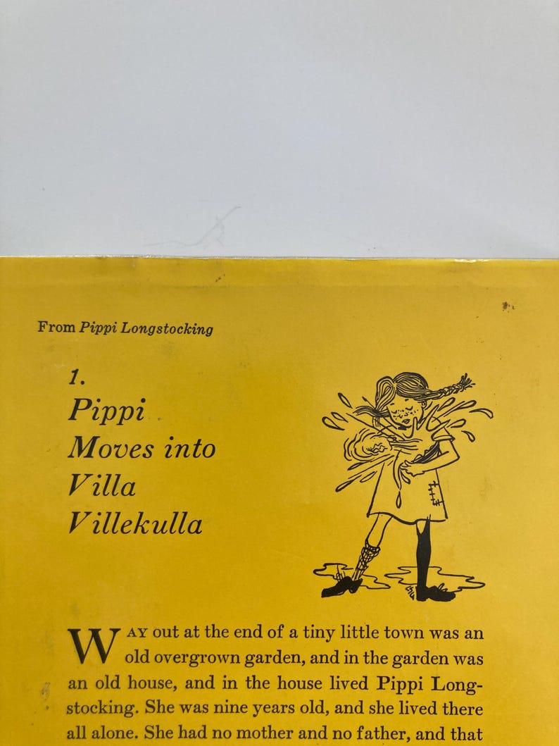 May include: A yellow book page featuring the text From Pippi Longstocking, 1. Pippi Moves into Villa Villekulla, and a black and white line drawing of a girl with braided hair splashing water. The text begins with a large W and describes a house.