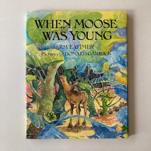 May include: A book cover with a watercolor illustration of a young moose standing in a forest. The title of the book is "When Moose Was Young" by Jim Latimer, with pictures by Donald Carrick.